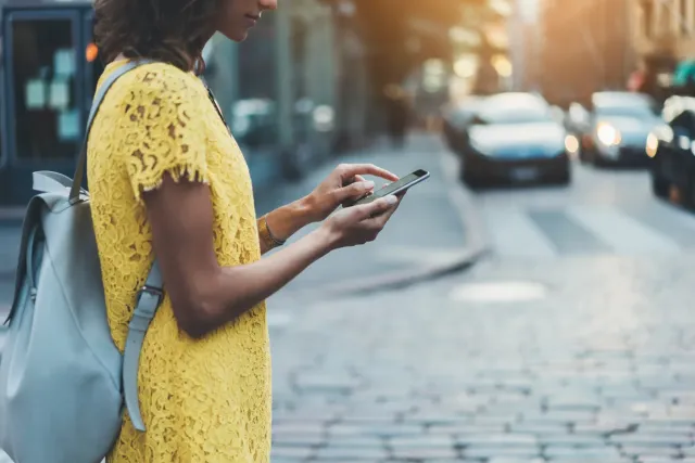 Person using a smartphone outdoors